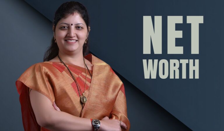 A woman in a traditional saree smiling confidently, standing beside bold text that says 'NET WORTH' on a dark blue background