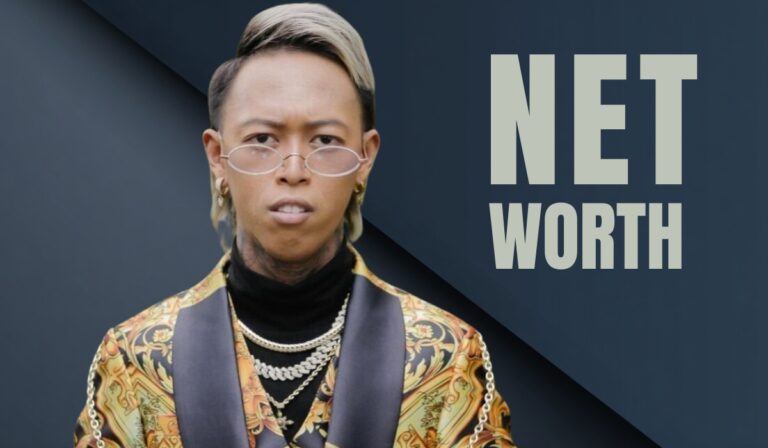Whamos Cruz wearing gold jewelry and designer clothes with "Net Worth" text in the background