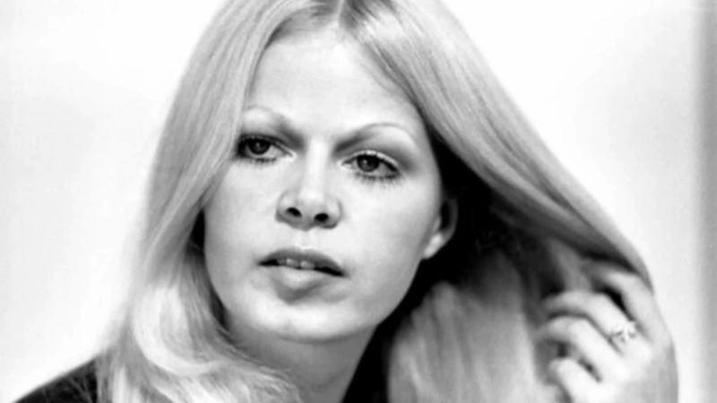 Young Sally Struthers in a black and white photo holding her hair