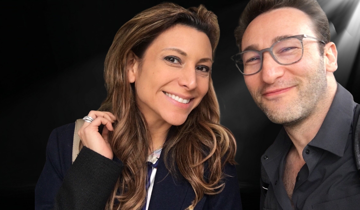 Simon Sinek smiling with a woman, highlighting ongoing speculation about his personal life