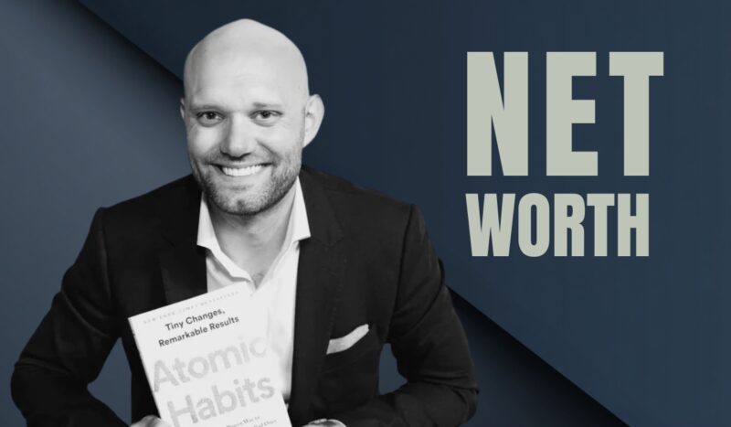 A smiling person in a suit holding a book titled Atomic Habits, with the words “Net Worth” displayed beside them on a dark blue background
