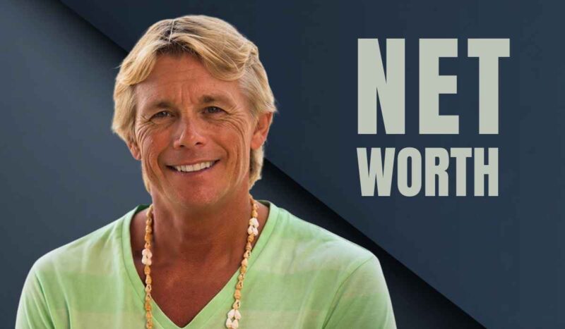 Smiling middle aged man wearing a green shirt against a graphic background