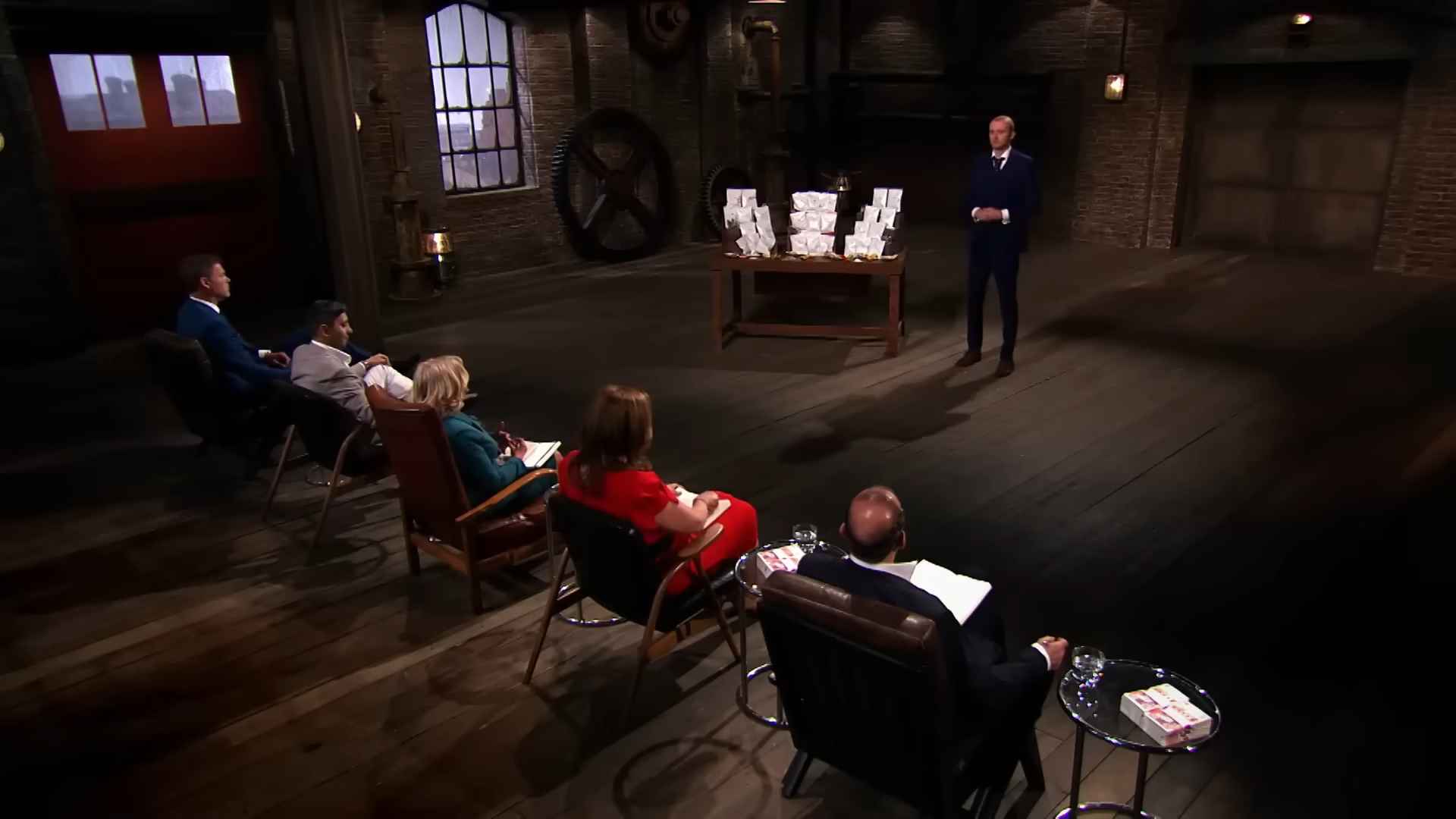 Set diagram of Dragons' Den showing investor seats and the pitch area