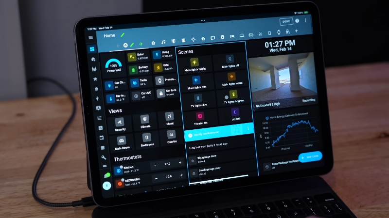 Smart home control dashboard on a tablet showin lights, climate, security, and energy systems