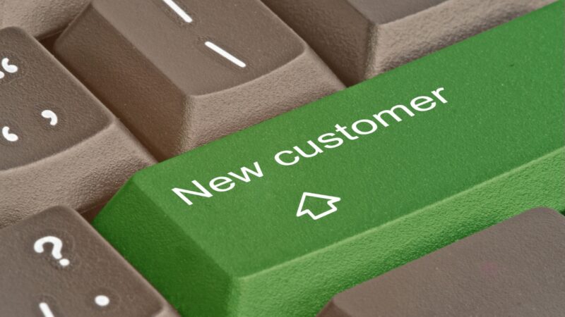 A green keyboard key reads “New customer” beside several question-mark keys
