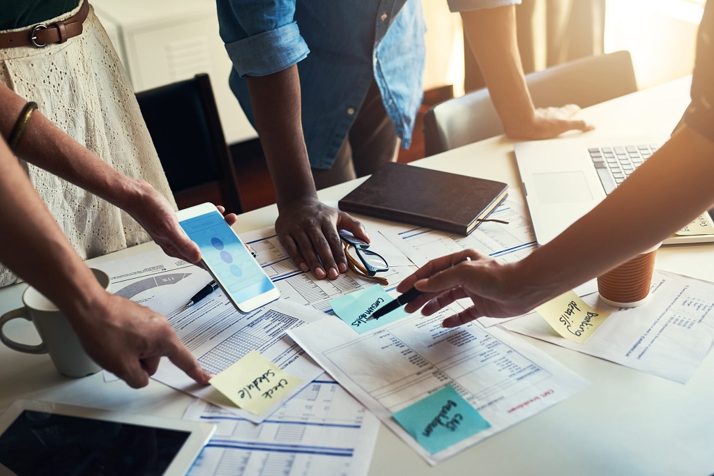 Team of business people working together in office, close-up